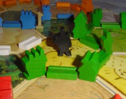 Catan: een rover omringd door ridders